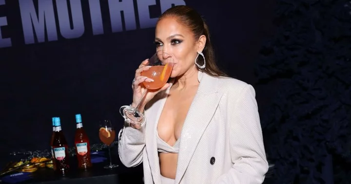 'I thought JLo didn’t drink?': Jennifer Lopez under scrutiny for promoting her cocktail brand in body-hugging swimsuit despite being non-alcoholic