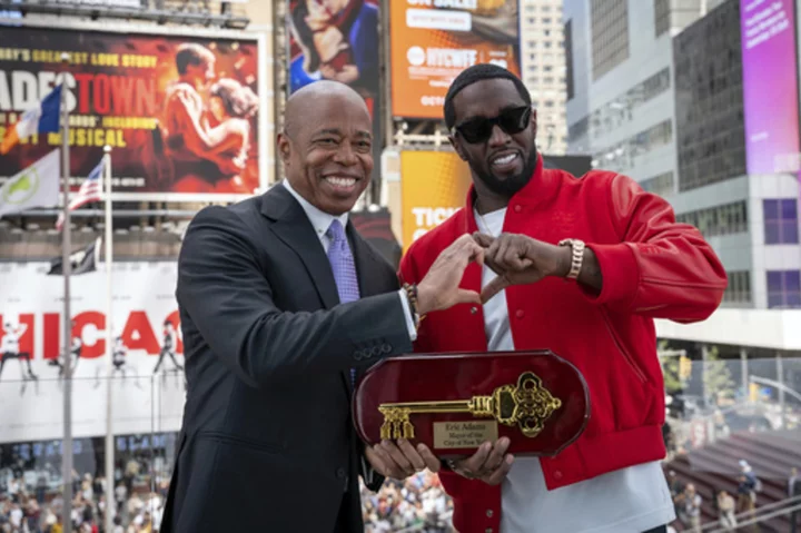 New York City mayor gives Sean 'Diddy' Combs a key to the city during a ceremony in Times Square